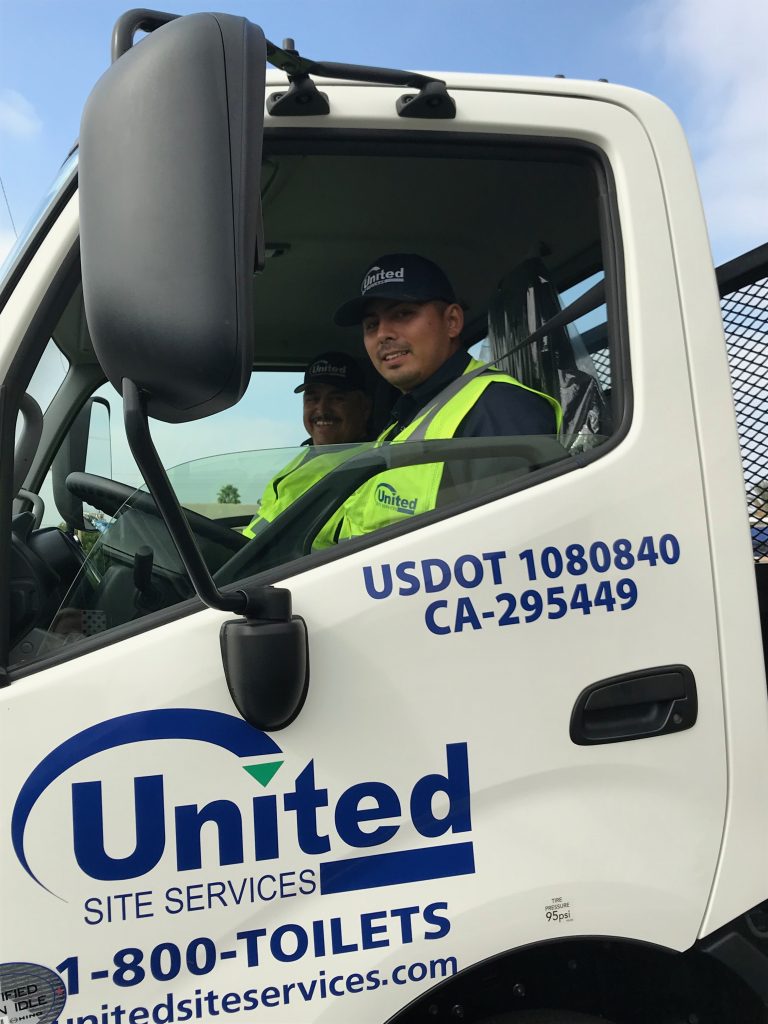 United Site Services Hino Hybrid Truck with a driver and passanger