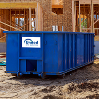 a roll-off dumpster on a construction site