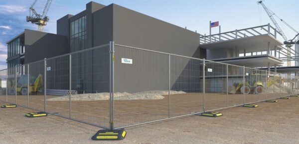 a building under construction surrounded by temporary fencing