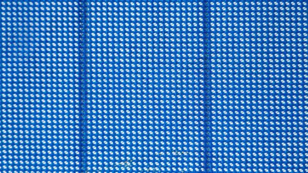 zoomed in view of blue material for a privacy fence