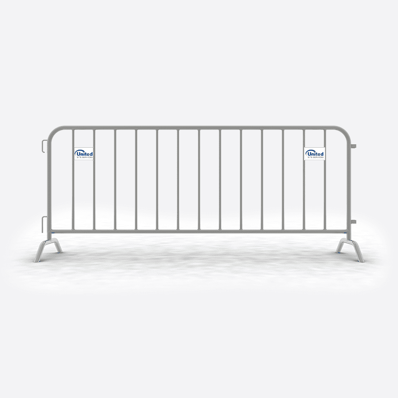 A portable metal barricade with vertical bars and two stabilizing feet at each end